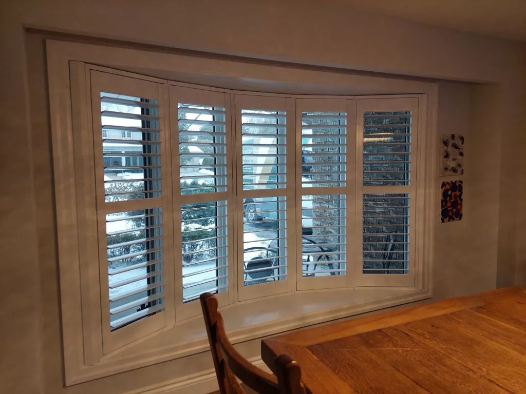 Beautiful bay windows with ShutterLux California Shutters