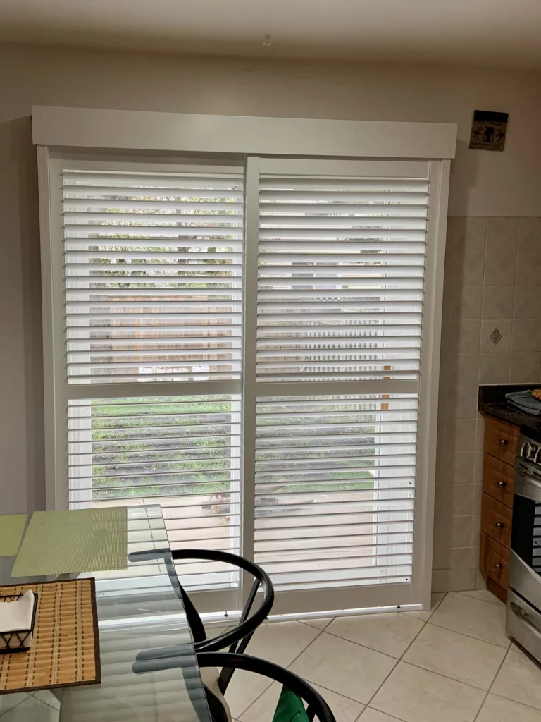 Patio door with PVC California Shutters from ShutterLux