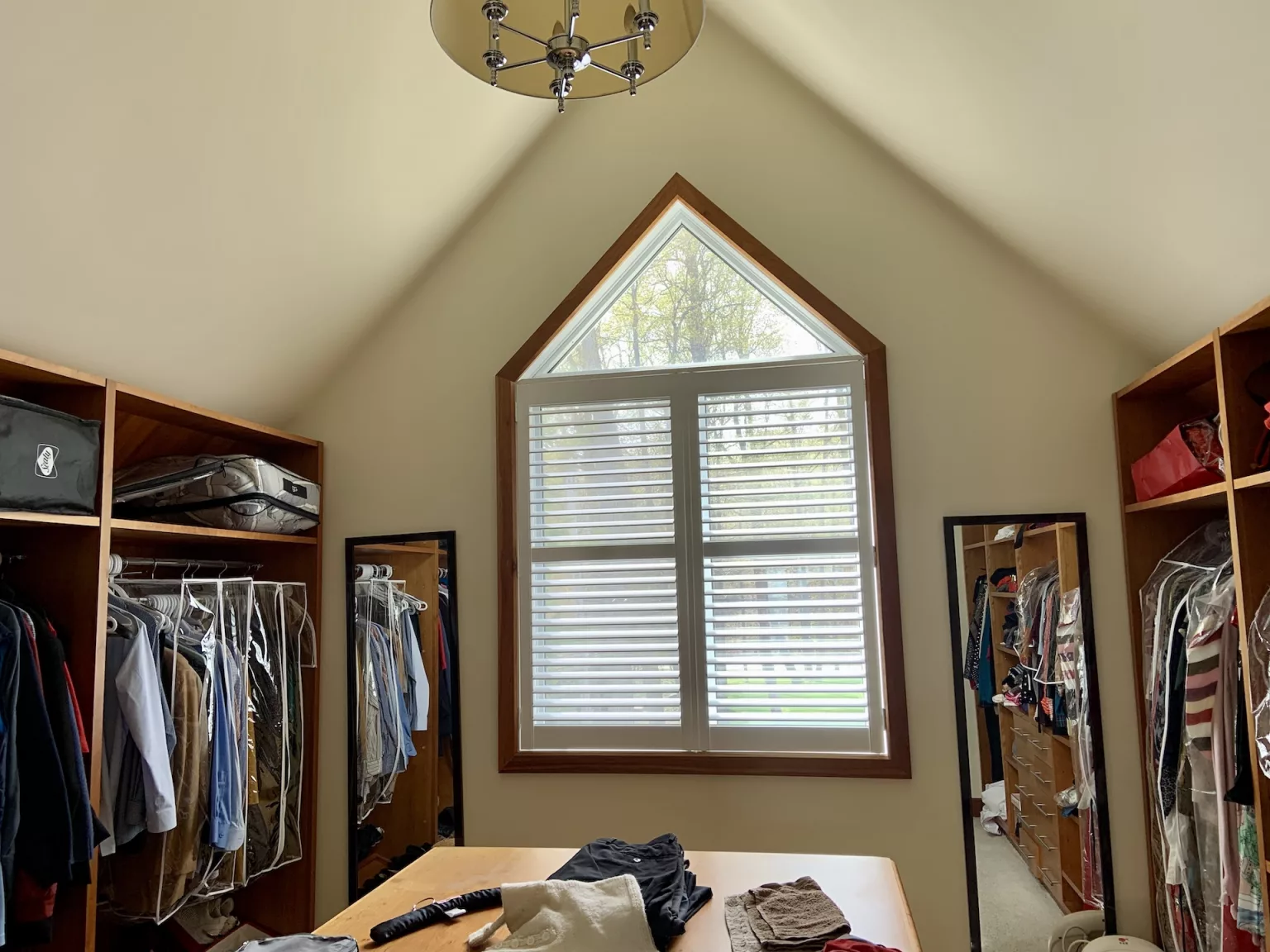 Closet room with custom-made ShutterLux California shutters (after)