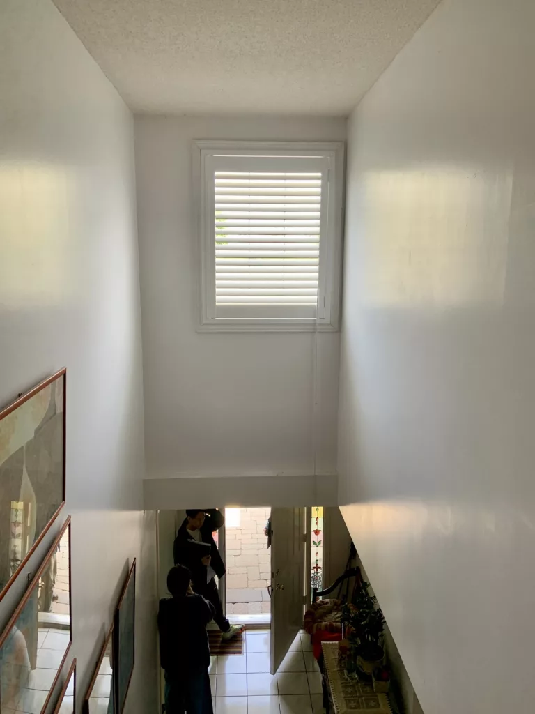 High window with PVC california shutters by ShutterLux Scarborough