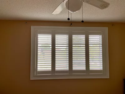 Window with PVC california shutters by ShutterLux Scarborough